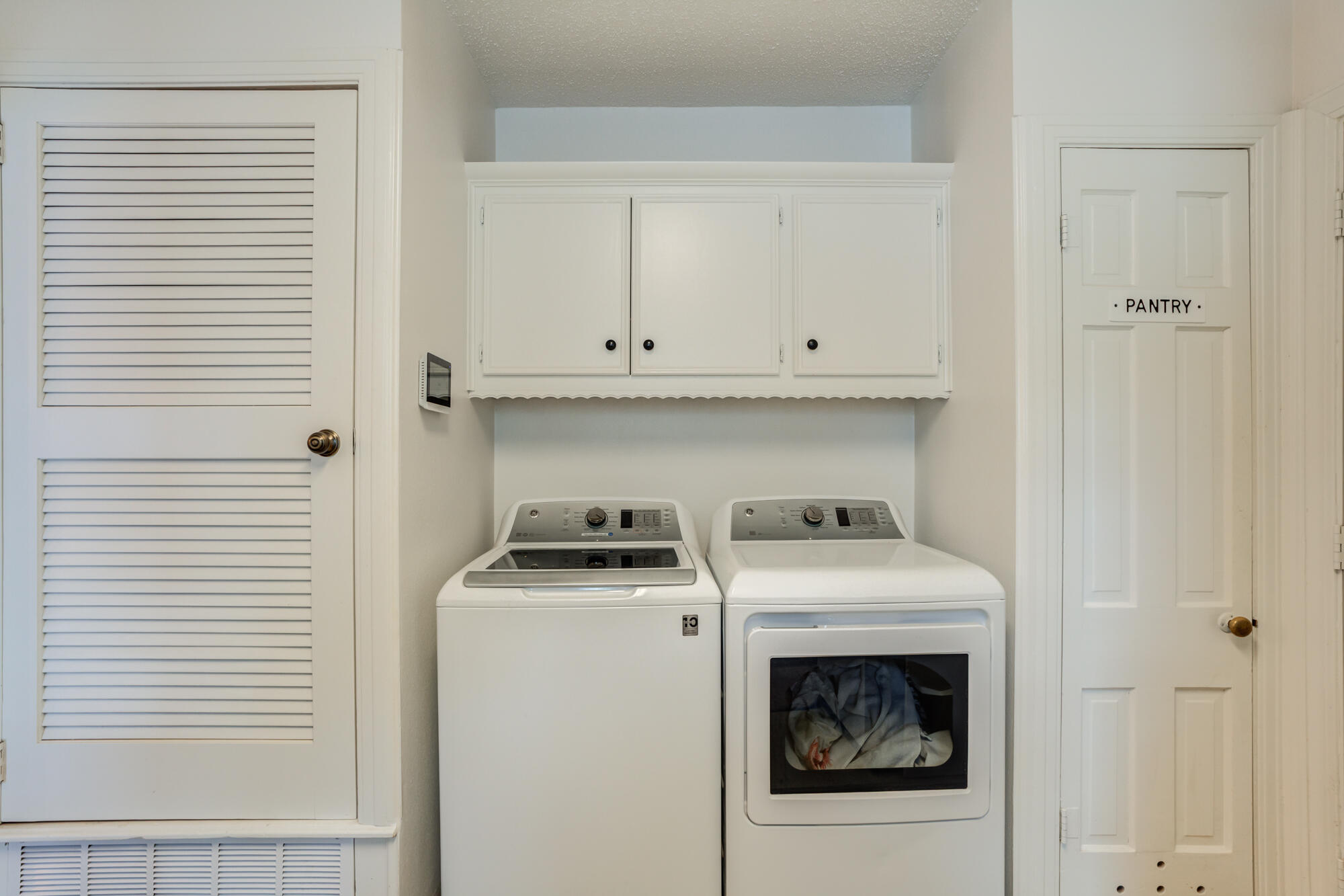 2826 33rd Street Lubbock, TX 79410 - Photo 23 of 33 a white stove top oven sitting inside of a kitchen