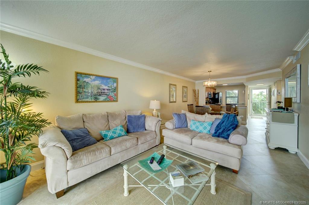 7380 South Ocean Drive, Unit 320 Jensen Beach, FL 34957 - Photo 18 of 39 a living room with furniture and a couch