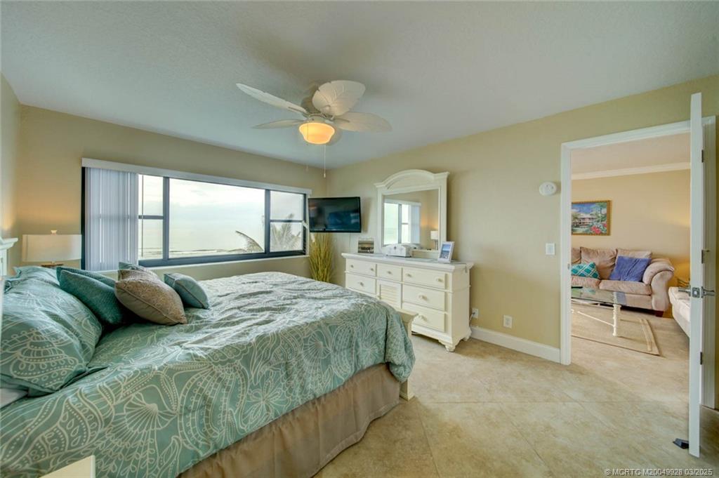 7380 South Ocean Drive, Unit 320 Jensen Beach, FL 34957 - Photo 20 of 39 a bedroom with a large bed and a view of bedroom