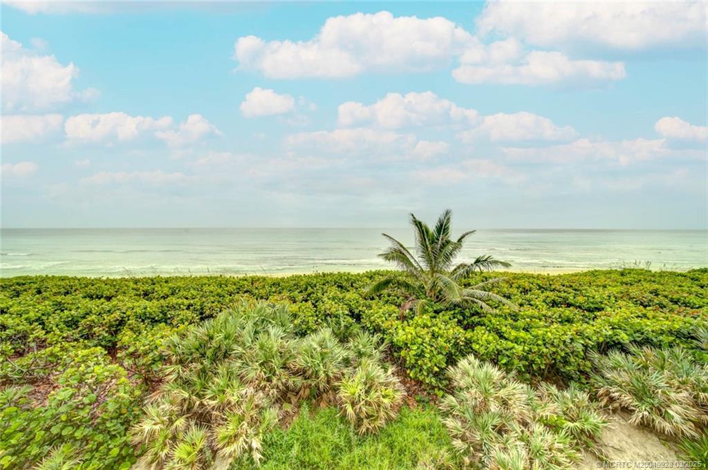 7380 South Ocean Drive, Unit 320 Jensen Beach, FL 34957 - Photo 2 of 39 a view of a bunch of trees and houses