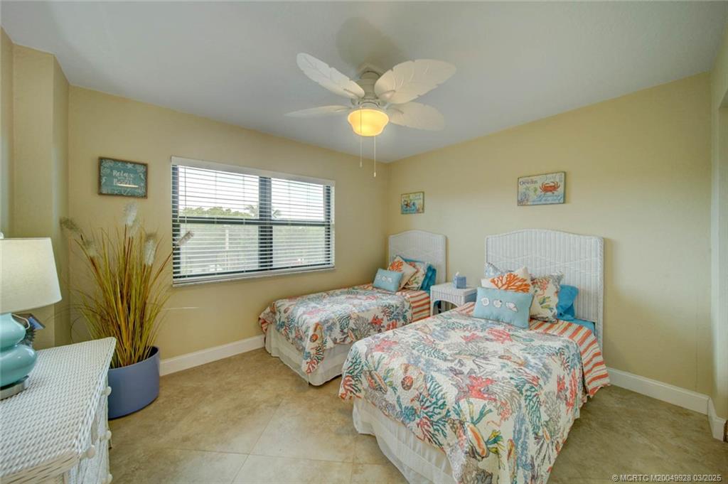 7380 South Ocean Drive, Unit 320 Jensen Beach, FL 34957 - Photo 25 of 39 a bedroom with bed and a window