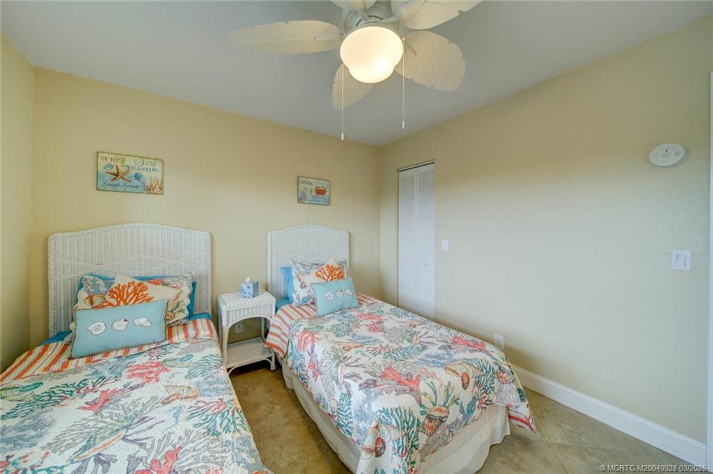 7380 South Ocean Drive, Unit 320 Jensen Beach, FL 34957 - Photo 26 of 39 a bedroom with a bed and window