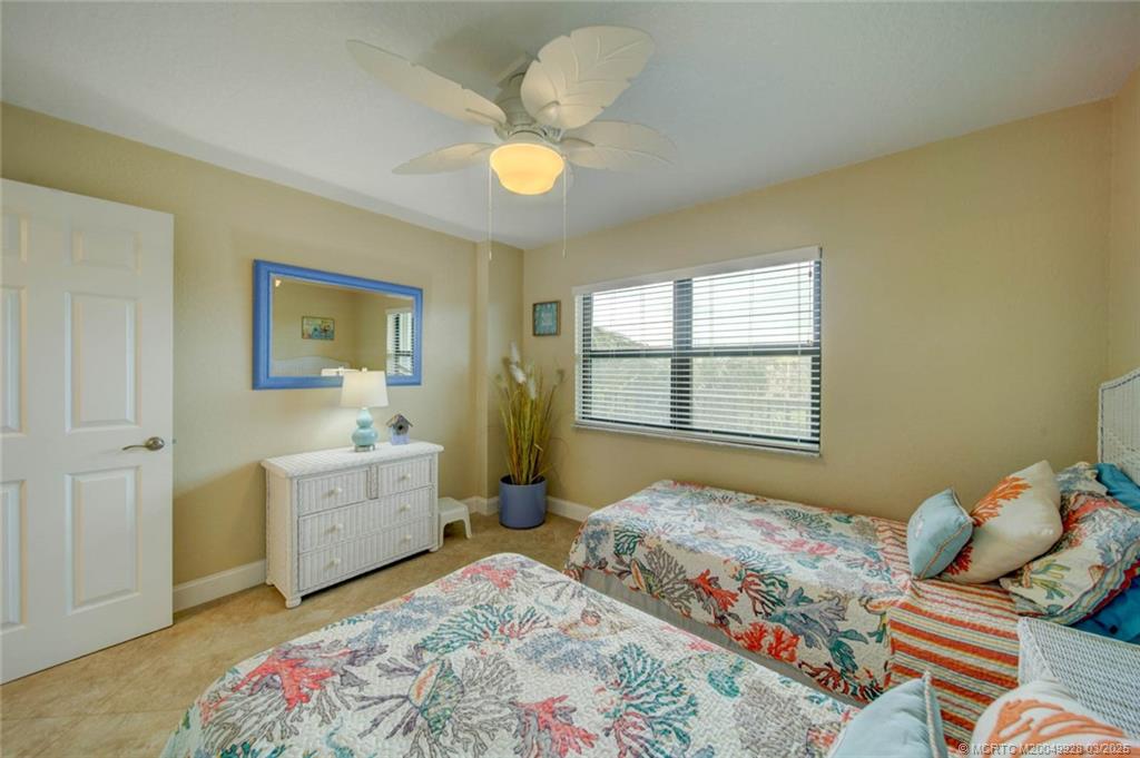 7380 South Ocean Drive, Unit 320 Jensen Beach, FL 34957 - Photo 27 of 39 a bedroom with a bed and furniture