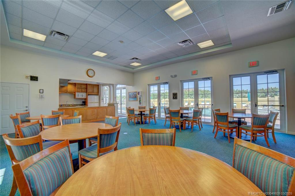 7380 South Ocean Drive, Unit 320 Jensen Beach, FL 34957 - Photo 34 of 39 a living room with dining room and wooden floor