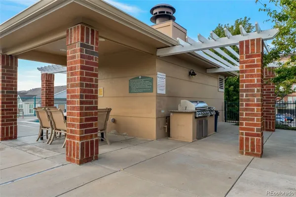 a front view of a house with outdoor seating