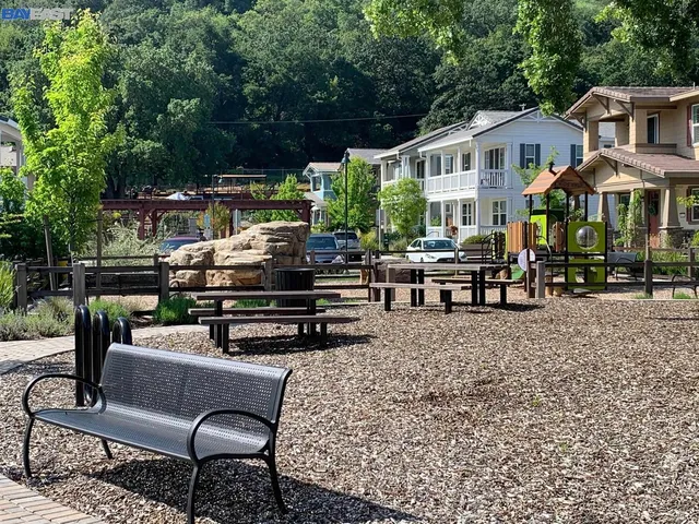 a view of a house with backyard sitting area and garden