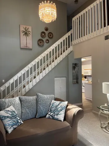 a living room with furniture and windows