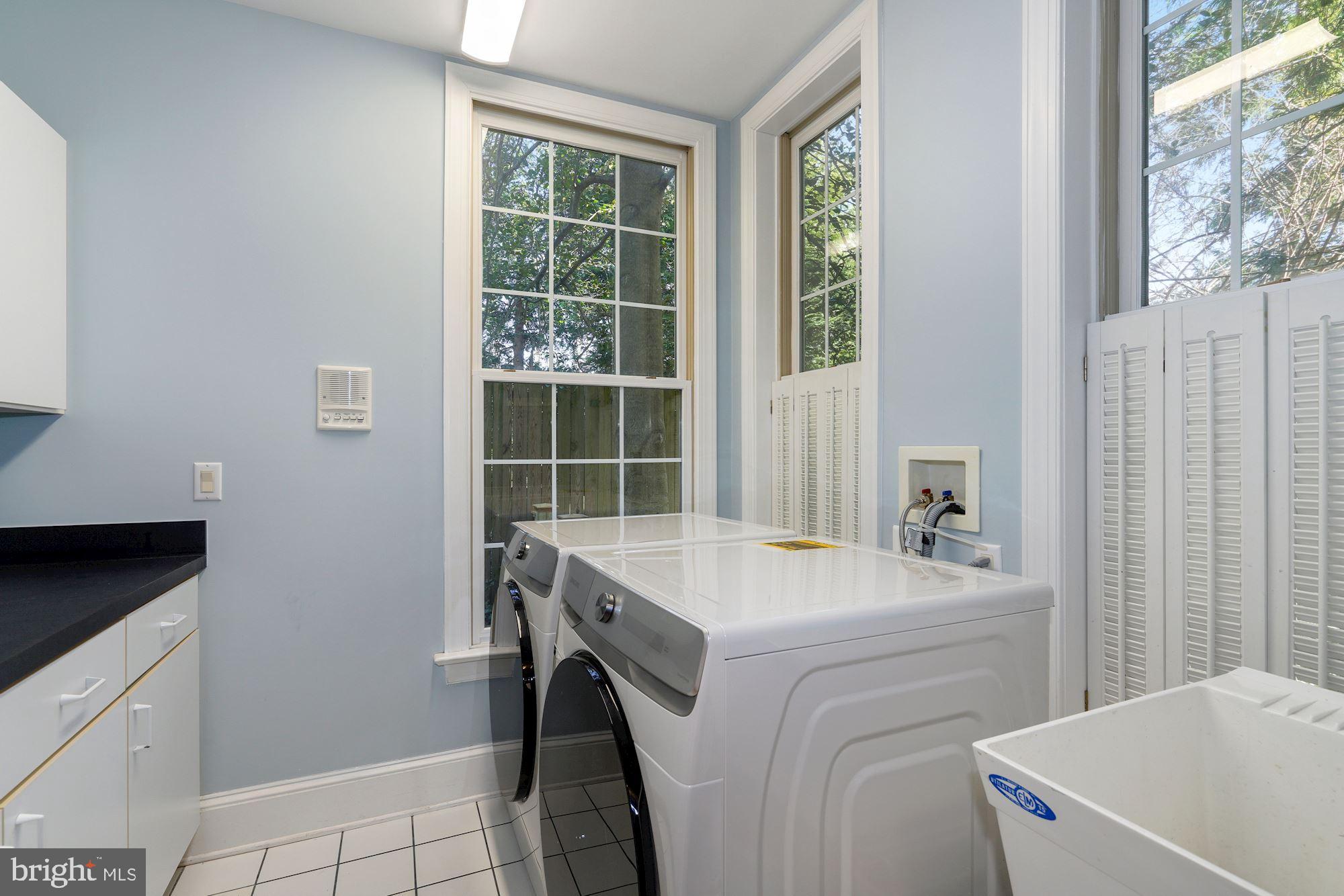 5910 Bradley Boulevard Bethesda, MD 20814 - Photo 12 of 42 First floor laundry with new W/D