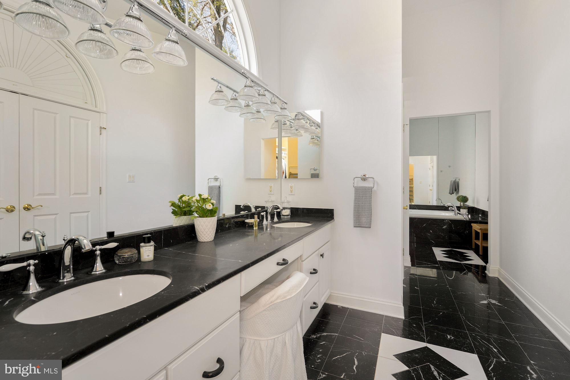 5910 Bradley Boulevard Bethesda, MD 20814 - Photo 15 of 42 Primary bath which opens to walk-in closet