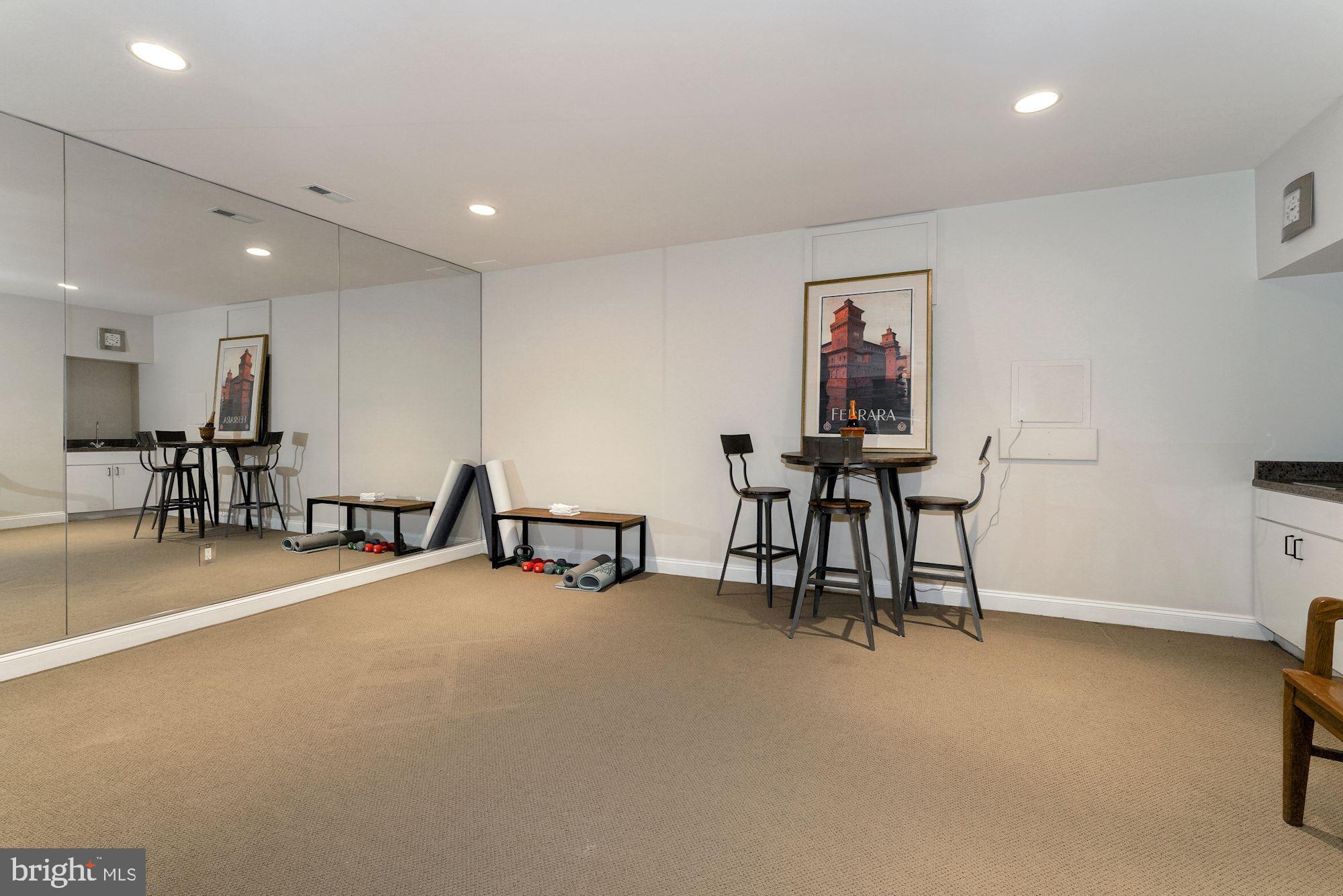 5910 Bradley Boulevard Bethesda, MD 20814 - Photo 26 of 42 Lower level gym or studio with wet bar