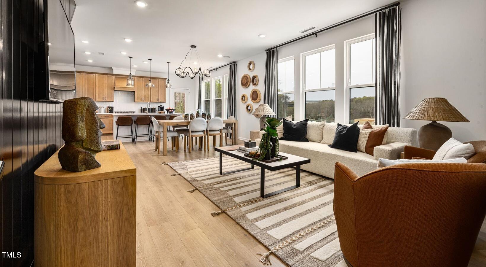 3709 Nova Star Lane, Unit GRADY Raleigh, NC 27612 - Photo 23 of 30 a living room with furniture and a large window