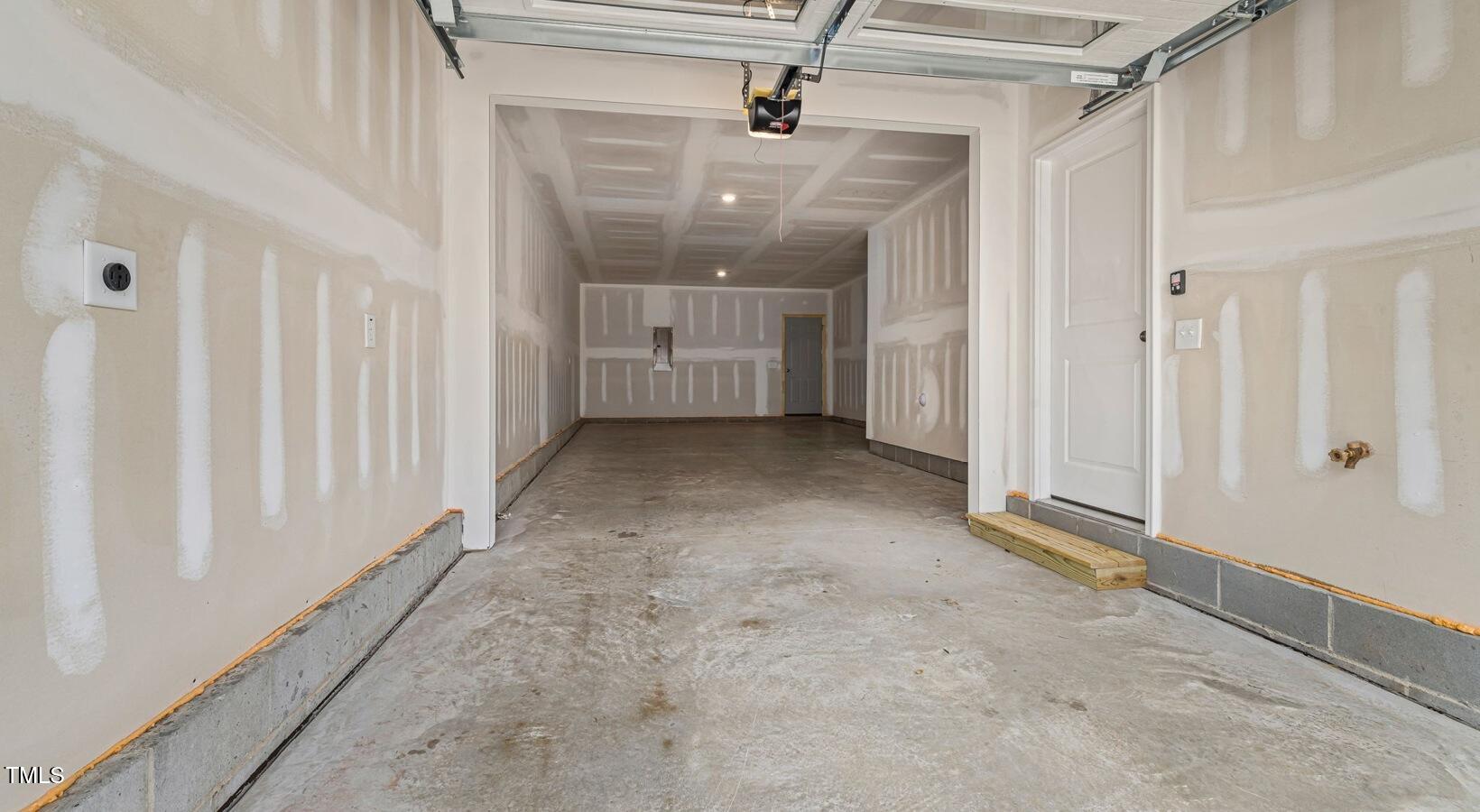 3709 Nova Star Lane, Unit GRADY Raleigh, NC 27612 - Photo 30 of 30 a view of a hallway with wooden shelves