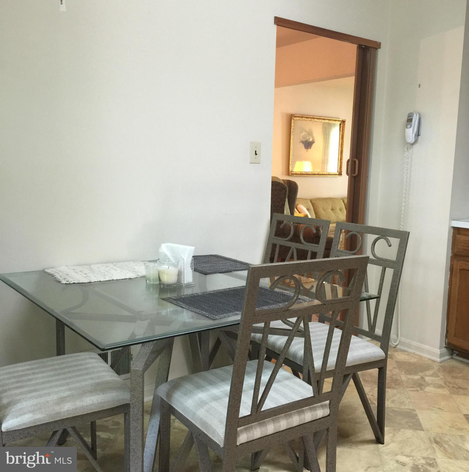 7705 Bock Road Fort Washington, MD 20744 - Photo 14 of 23 a view of a dining room with furniture and wooden floor