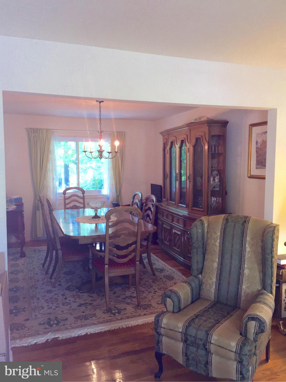 7705 Bock Road Fort Washington, MD 20744 - Photo 8 of 23 a living room with furniture and a dining table