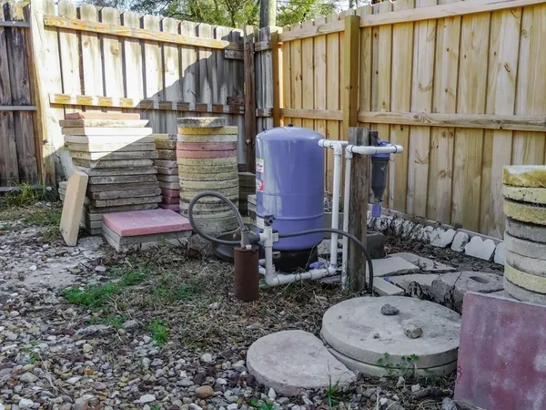 a backyard of a house with outdoor seating