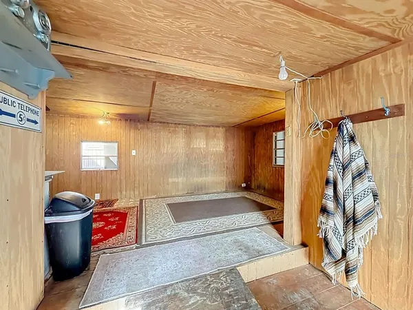 a bathroom with stainless steel appliances a bath tub and shower