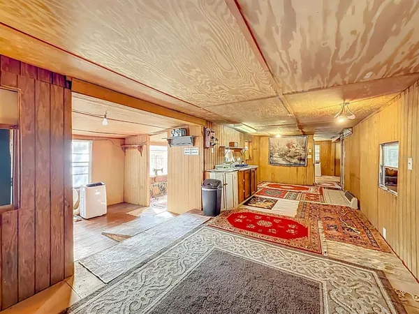 a living room with a rug