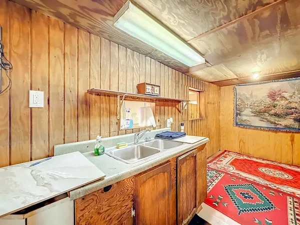 a kitchen with a sink and a window