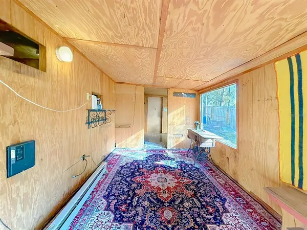 a bed room with a bed and a window