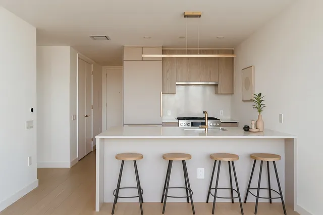 a kitchen with stainless steel appliances granite countertop a sink and a refrigerator