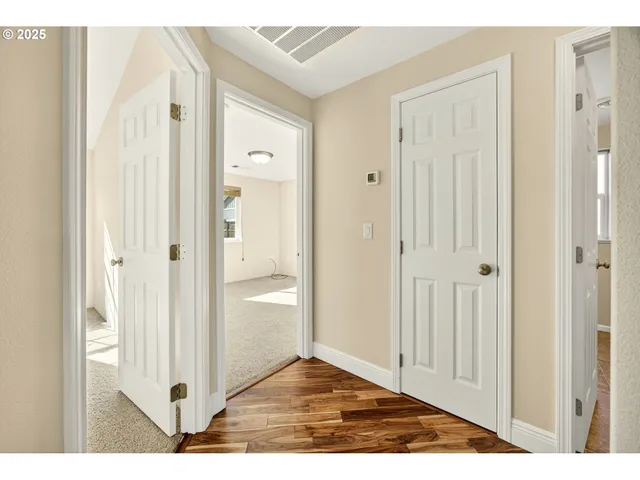 a view of a bathroom from a hallway