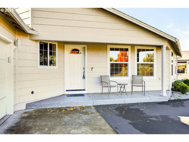 a front view of a house with large windows