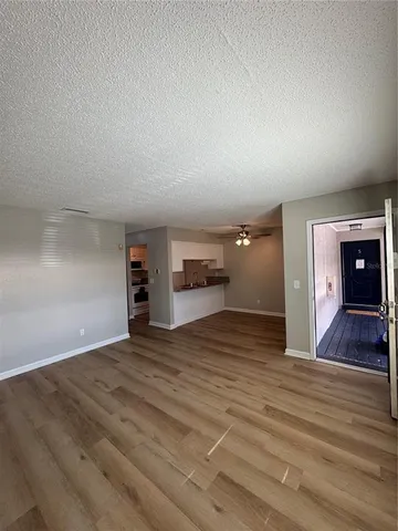 a view of a livingroom with furniture and a flat screen tv