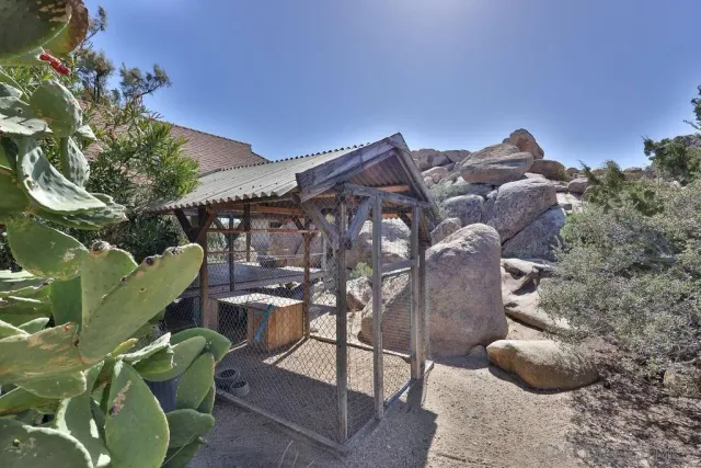 a view of a large building with a mountain in the background