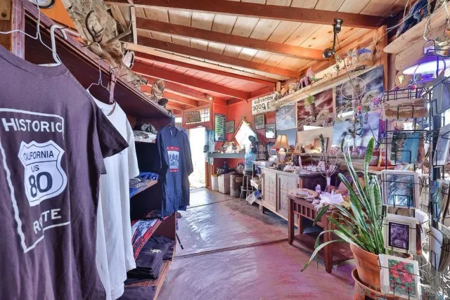 a view of a backyard with large trees