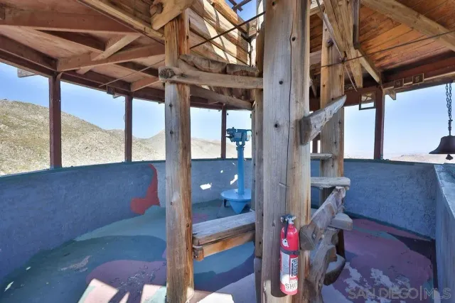 a view of a floor to ceiling window with wooden floor