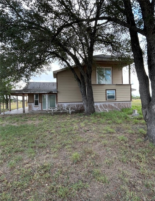 403 County Road 149 Alice, TX 78332 - Photo 2 of 17 a front view of a house with garden