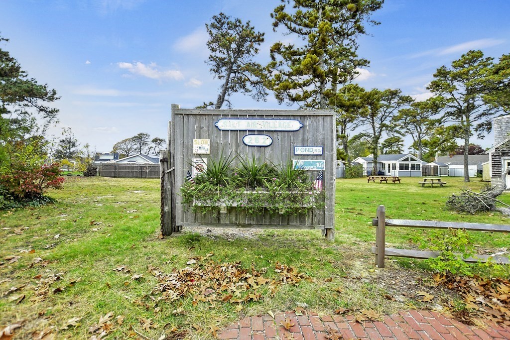 262 Old Wharf Road, Unit 103 Dennis, MA 02639 - Photo 2 of 30 a view of a yard in front of a house