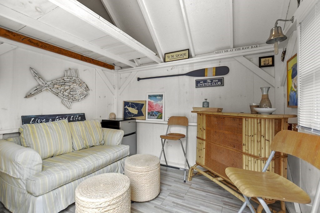 262 Old Wharf Road, Unit 103 Dennis, MA 02639 - Photo 27 of 30 a living room with furniture and a rug