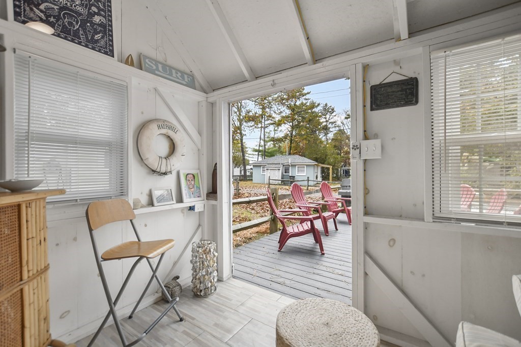 262 Old Wharf Road, Unit 103 Dennis, MA 02639 - Photo 28 of 30 a living room with furniture and a large window