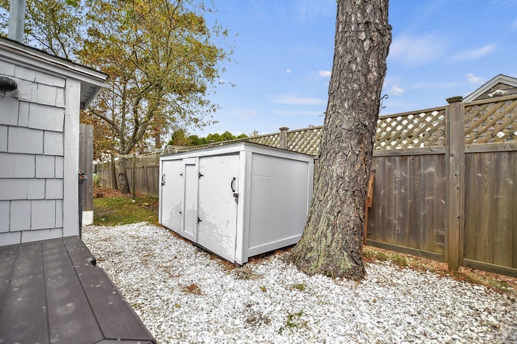 262 Old Wharf Road, Unit 103 Dennis, MA 02639 - Photo 29 of 30 a view of a house with a yard and pathway