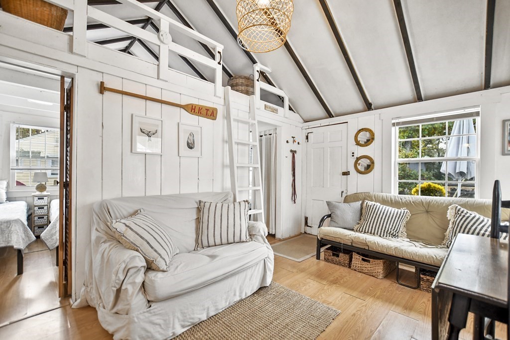 262 Old Wharf Road, Unit 103 Dennis, MA 02639 - Photo 8 of 30 a living room with furniture and a large window