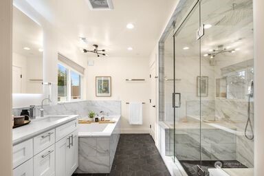 2411 Southwest 346th Street Federal Way, WA 98023 - Photo 14 of 30 a bathroom with a double vanity sink mirror and shower