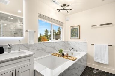 2411 Southwest 346th Street Federal Way, WA 98023 - Photo 15 of 30 a bathroom with a sink and a bathtub