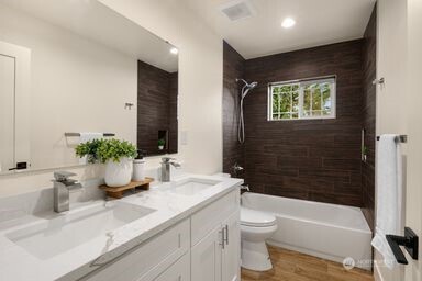 2411 Southwest 346th Street Federal Way, WA 98023 - Photo 29 of 30 a bathroom with a sink a toilet and shower