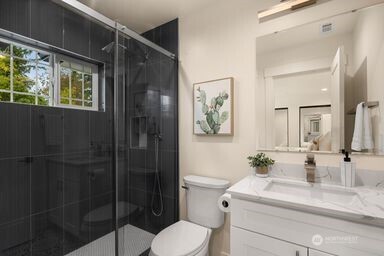 2411 Southwest 346th Street Federal Way, WA 98023 - Photo 30 of 30 a bathroom with a sink toilet and shower