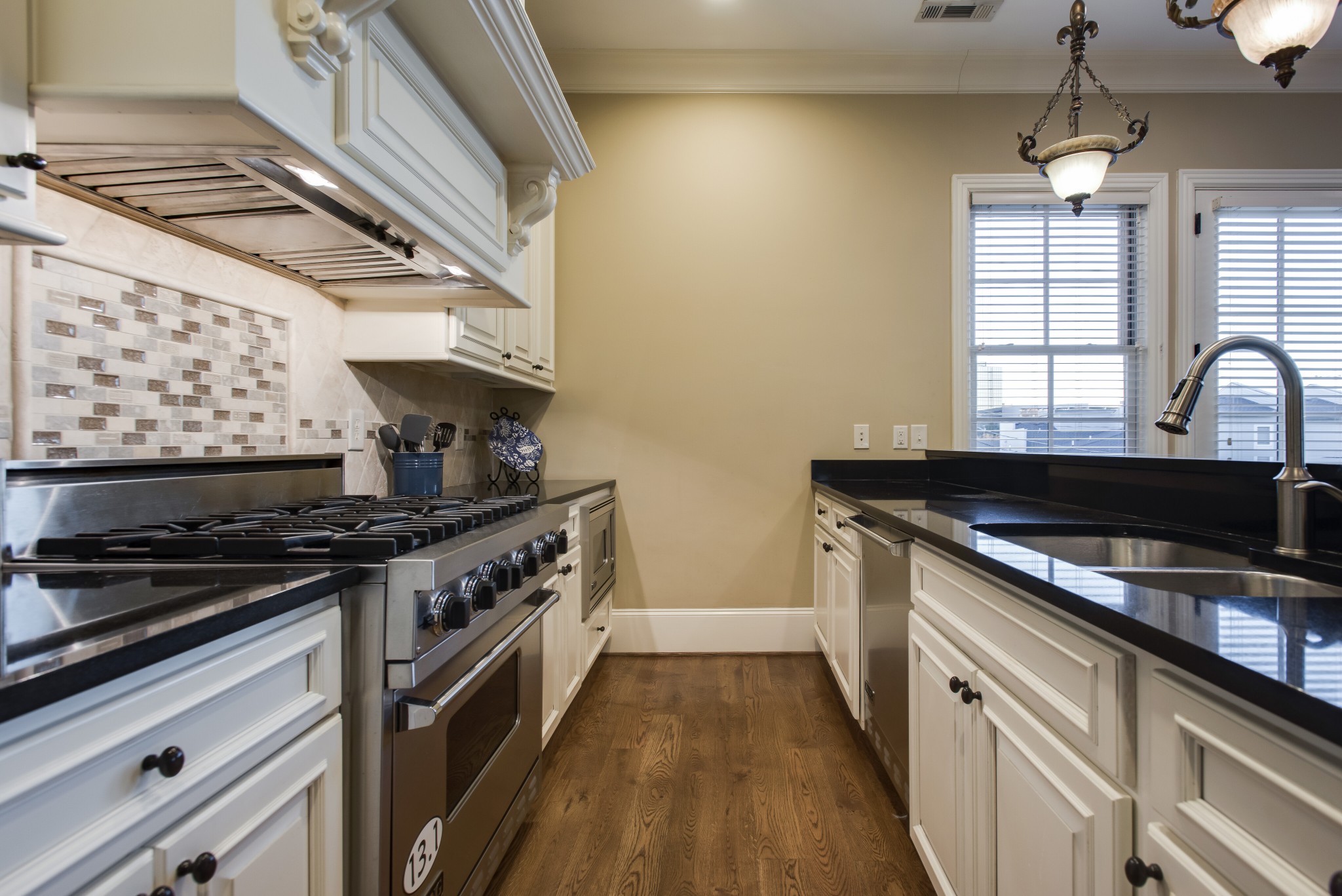 3127 Parthenon Avenue Nashville, TN 37203 - Photo 12 of 30 a kitchen with a stove and a sink