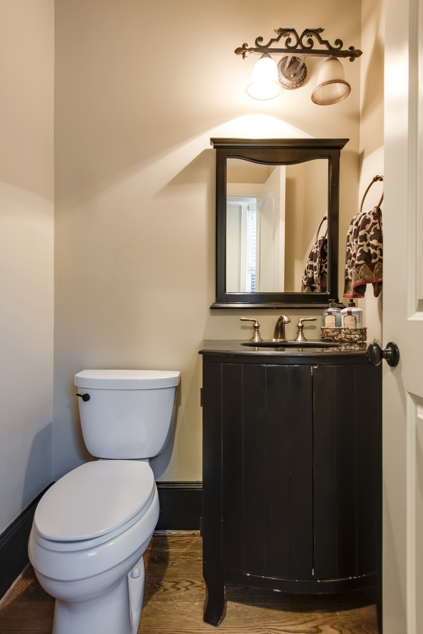 3127 Parthenon Avenue Nashville, TN 37203 - Photo 13 of 30 a bathroom with a toilet sink and mirror