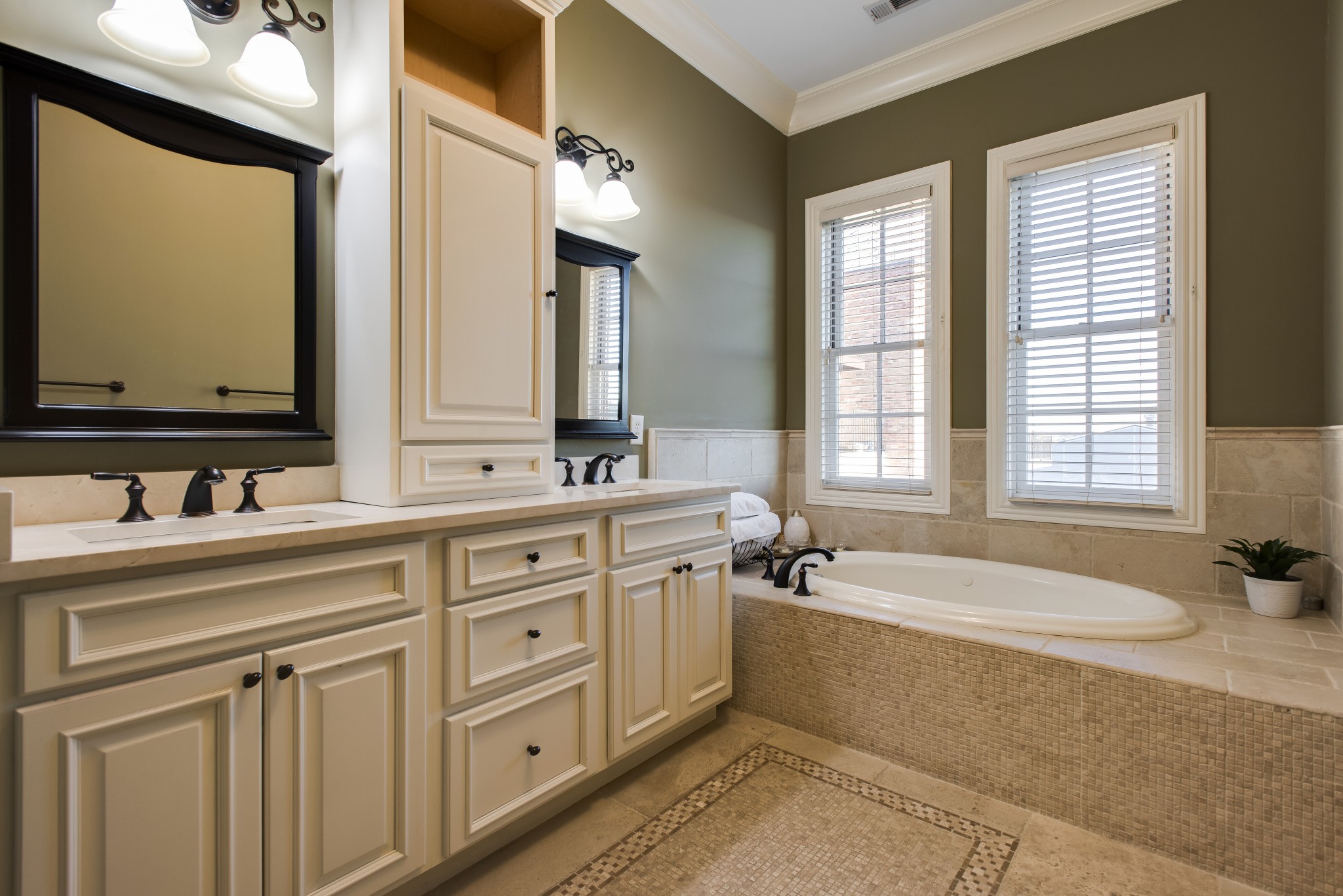 3127 Parthenon Avenue Nashville, TN 37203 - Photo 16 of 30 a spacious bathroom with a double vanity sink bathtub large mirror and window