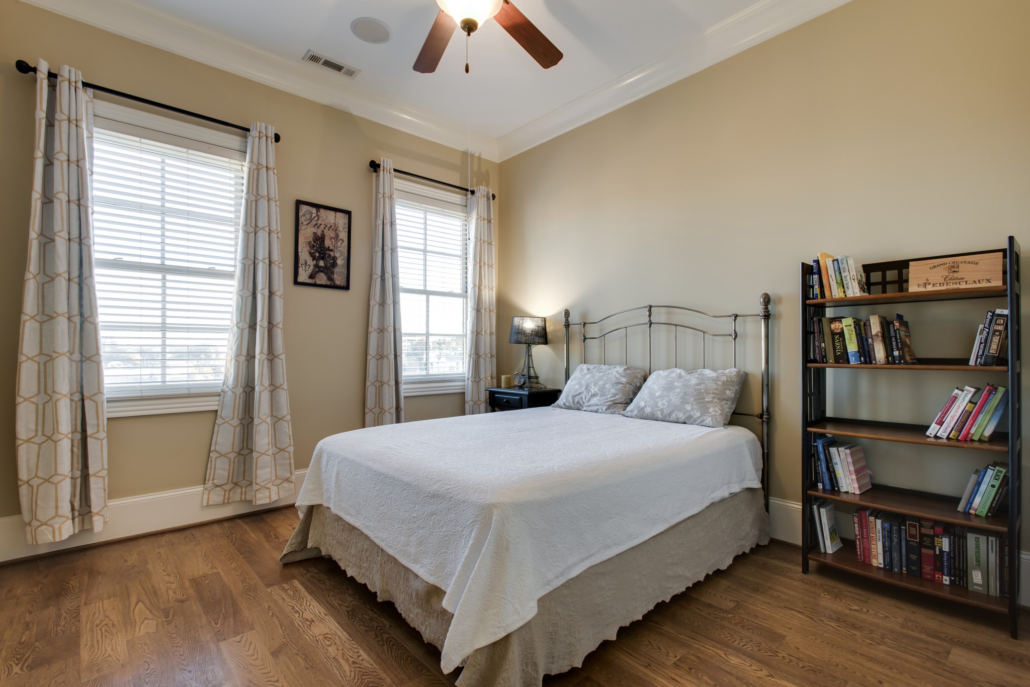 3127 Parthenon Avenue Nashville, TN 37203 - Photo 19 of 30 a bedroom with a bed and a book shelf