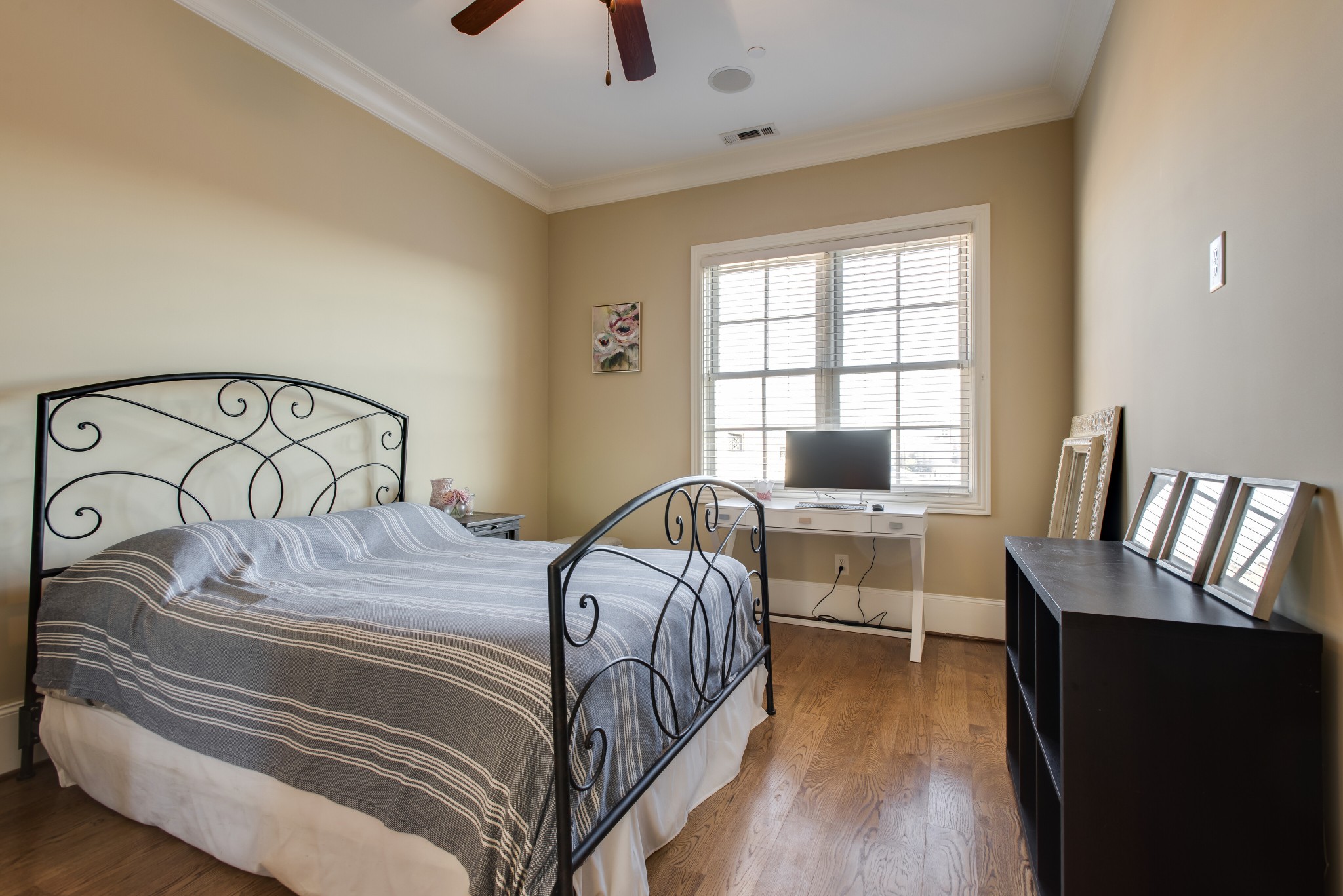 3127 Parthenon Avenue Nashville, TN 37203 - Photo 21 of 30 a bedroom with a bed and wooden floor