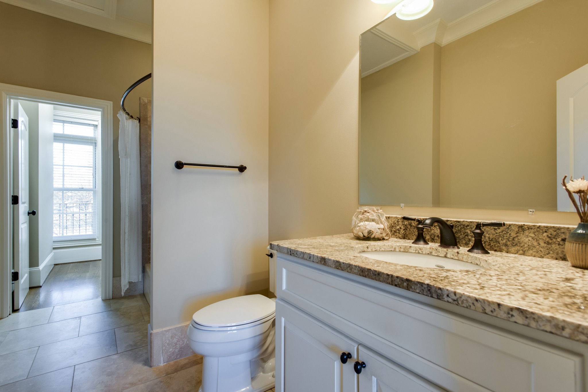 3127 Parthenon Avenue Nashville, TN 37203 - Photo 22 of 30 a bathroom with a granite countertop sink toilet and shower