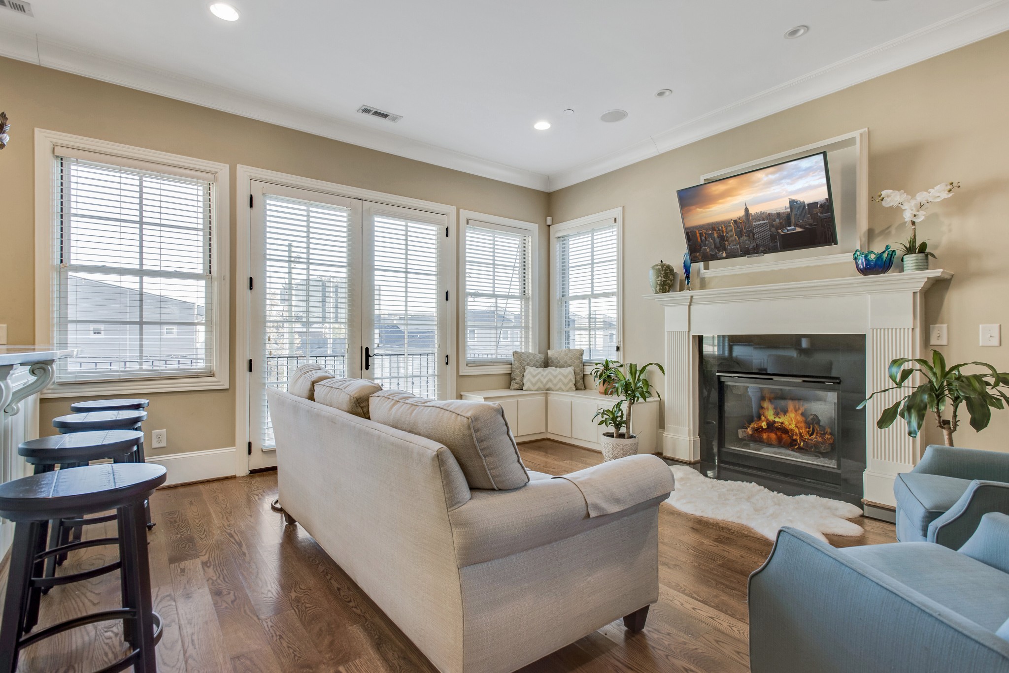 3127 Parthenon Avenue Nashville, TN 37203 - Photo 7 of 30 a living room with furniture a flat screen tv and a fireplace