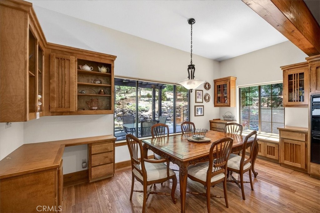 915 Golf Club Road Westwood, CA 96137 - Photo 23 of 67 a view of a dining room with furniture window and wooden floor
