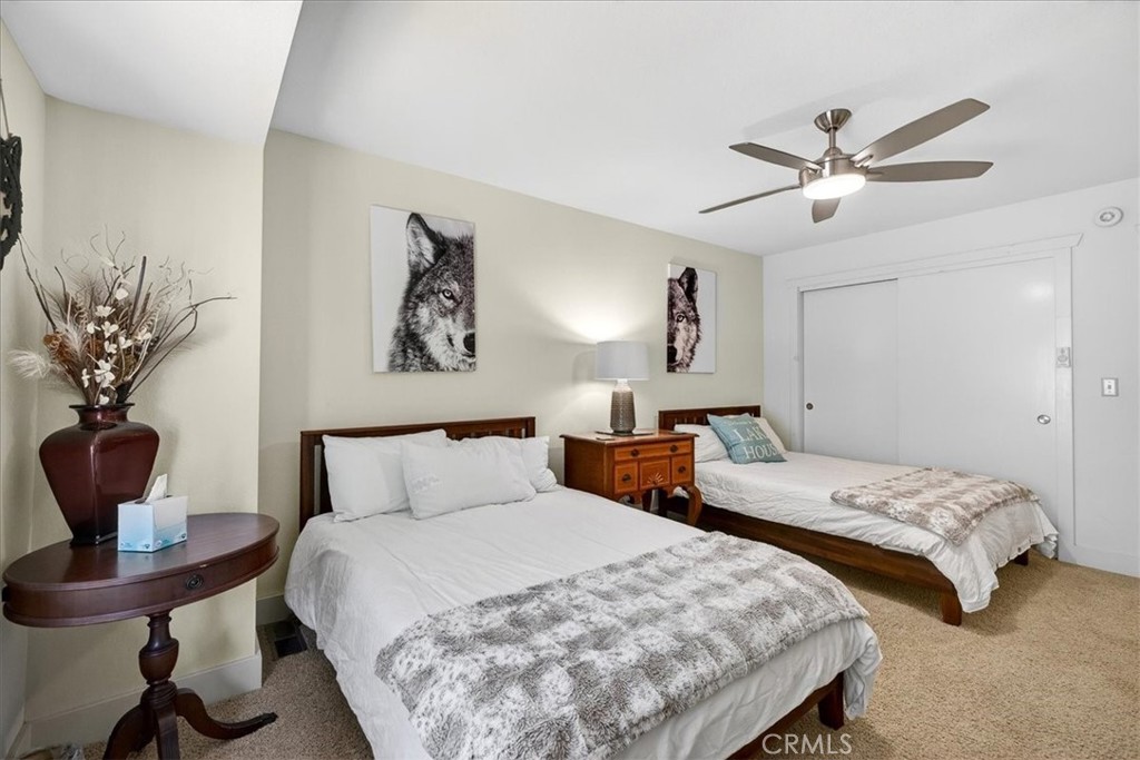 915 Golf Club Road Westwood, CA 96137 - Photo 43 of 67 a bedroom with two beds and a potted plant