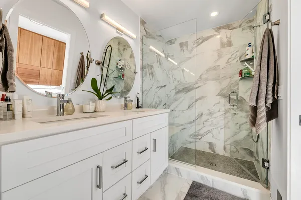 a bathroom with a sink and a mirror